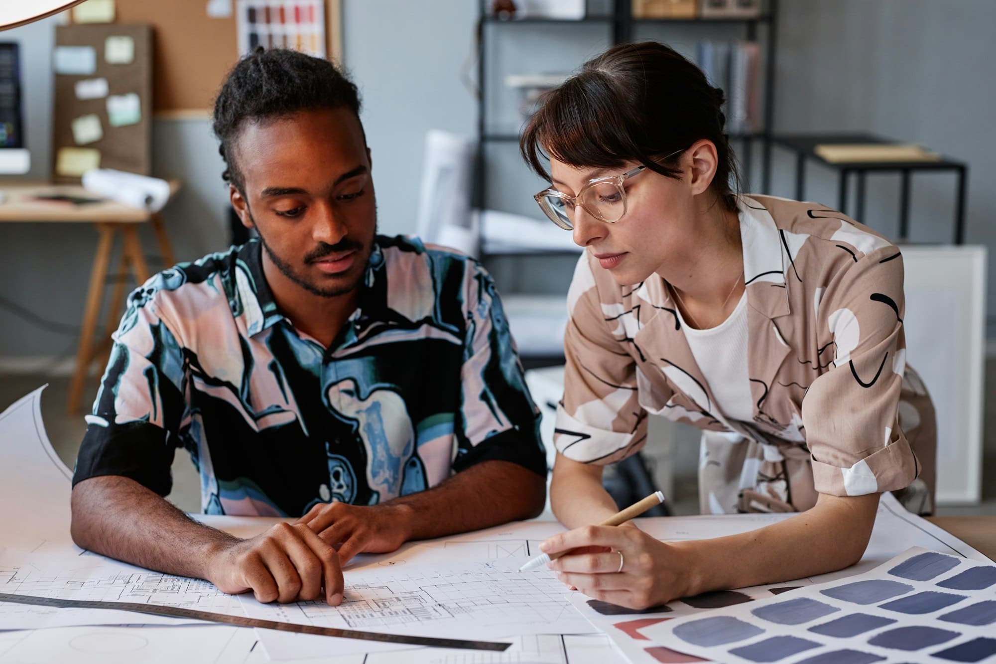 Couple working on floor plans for interior design