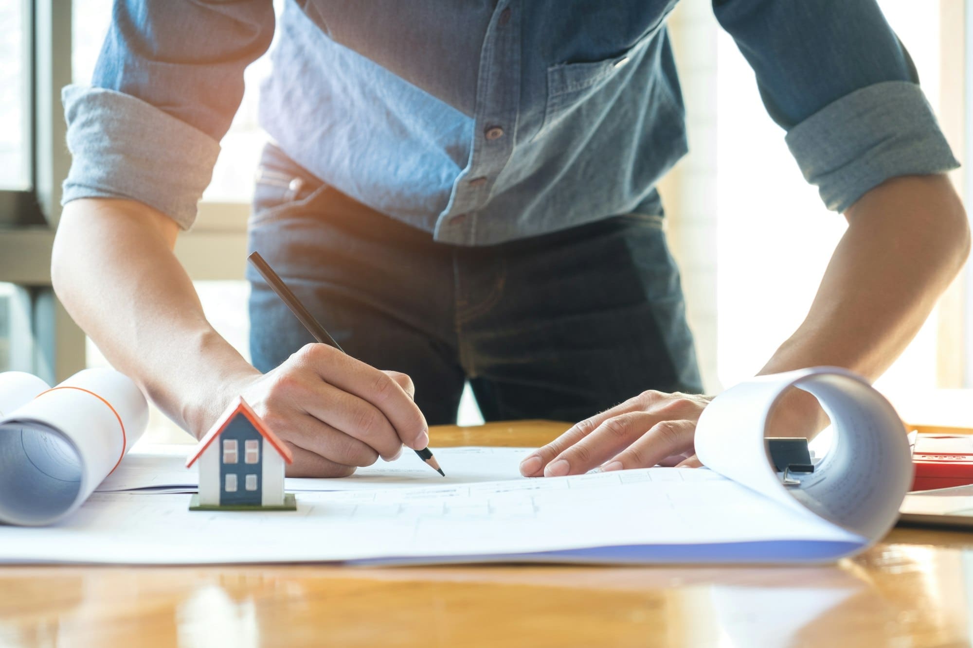 Home Design,Architects are using pencil designing the house.